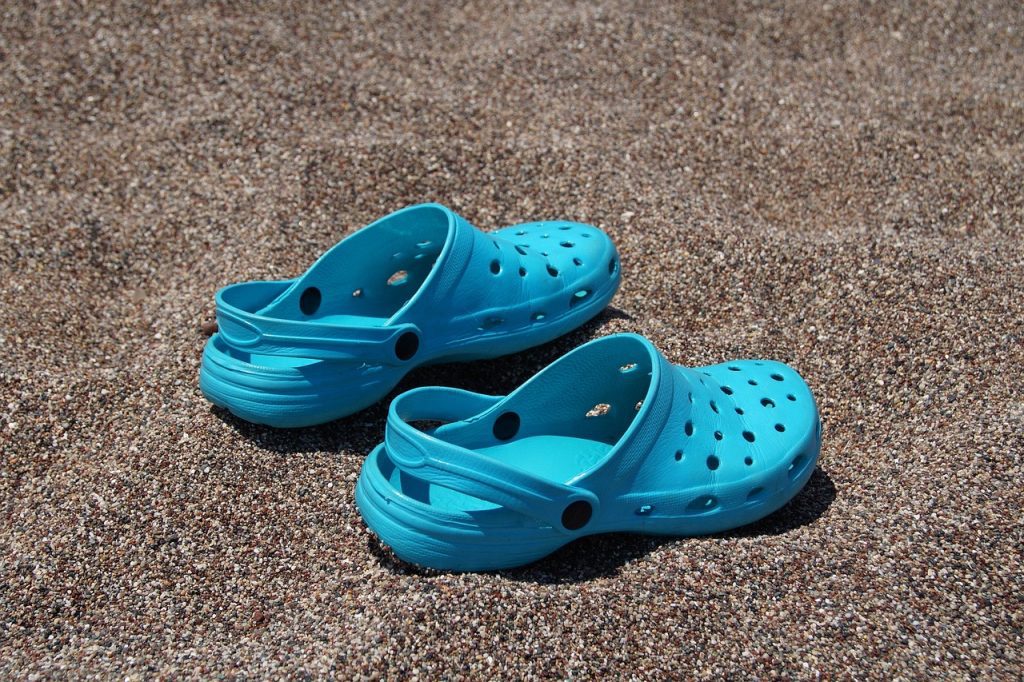 Blue crocs on the beach